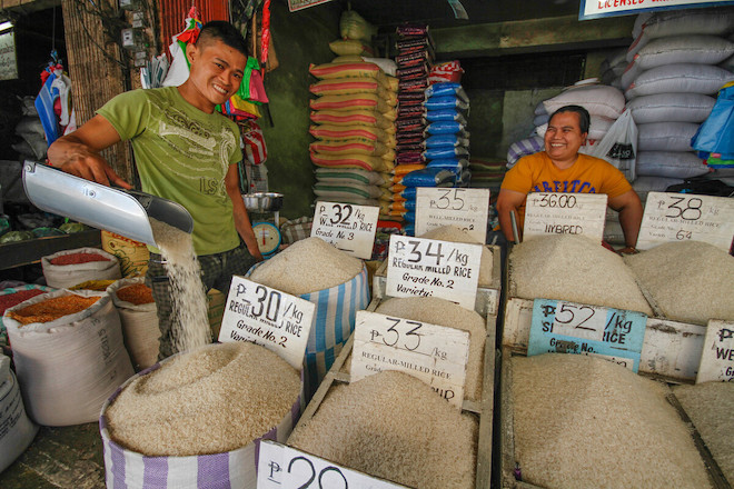 Business owners tend to their stall in a market in the Philippines.