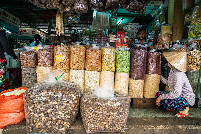 A man tends to his business in a market in Viet Nam.