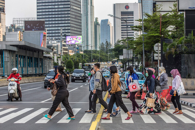 People crossing the street in Jakarta.