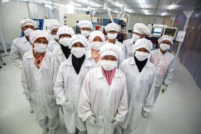 Workers posing in a lab.