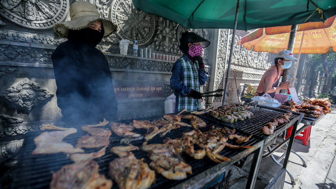 Street vendors plying their goods in Cambodia.