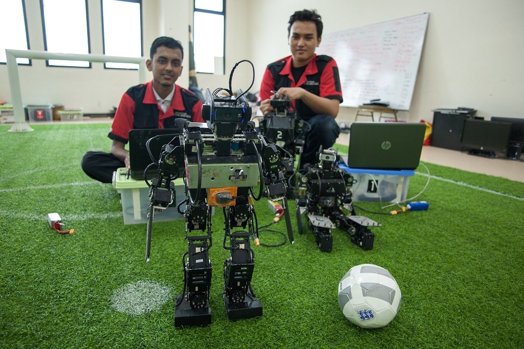 Mechatronics students in Indonesia work on their soccer-bots. Photo credit: ADB.