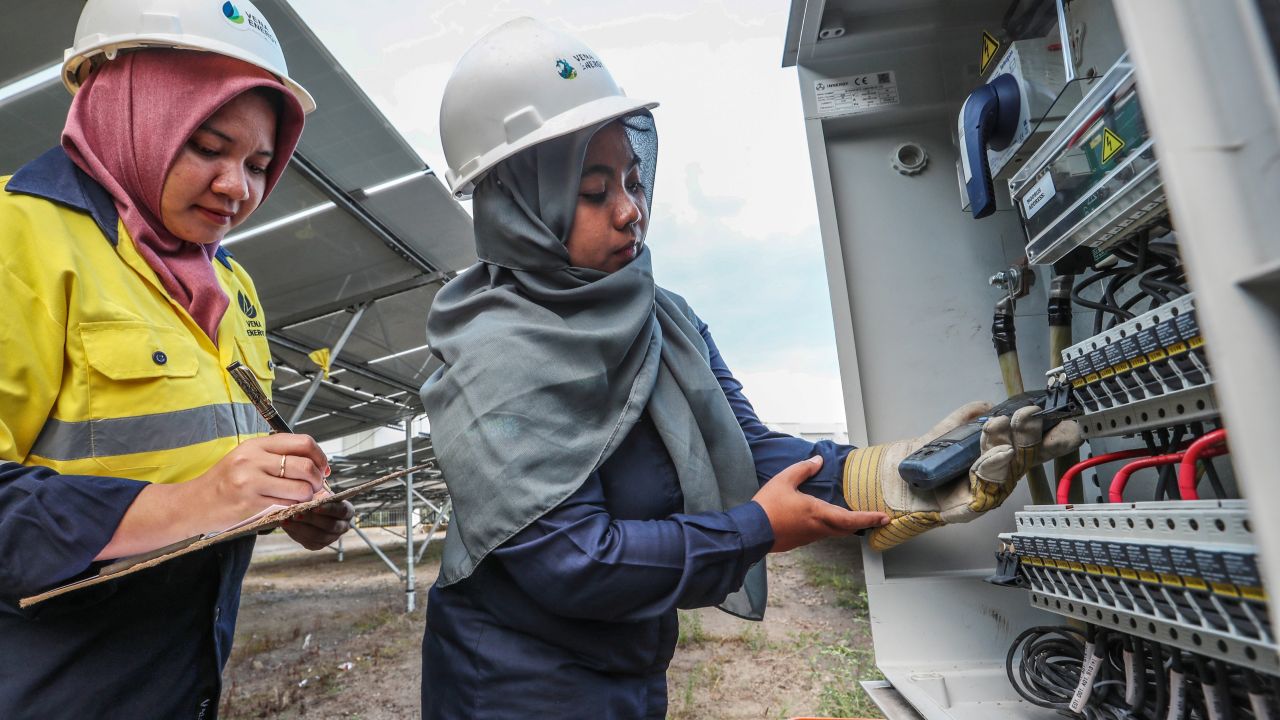 Vena Energy staff Nurul Hidayah and Fatma Mulyana perform operations and maintenance work at Selong in Lombok island, Indonesia.