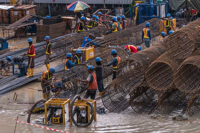 Men working at a construction site in Jakarta.