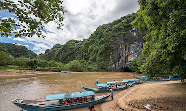Tourist boats lined up along the Mekong River in Viet Nam