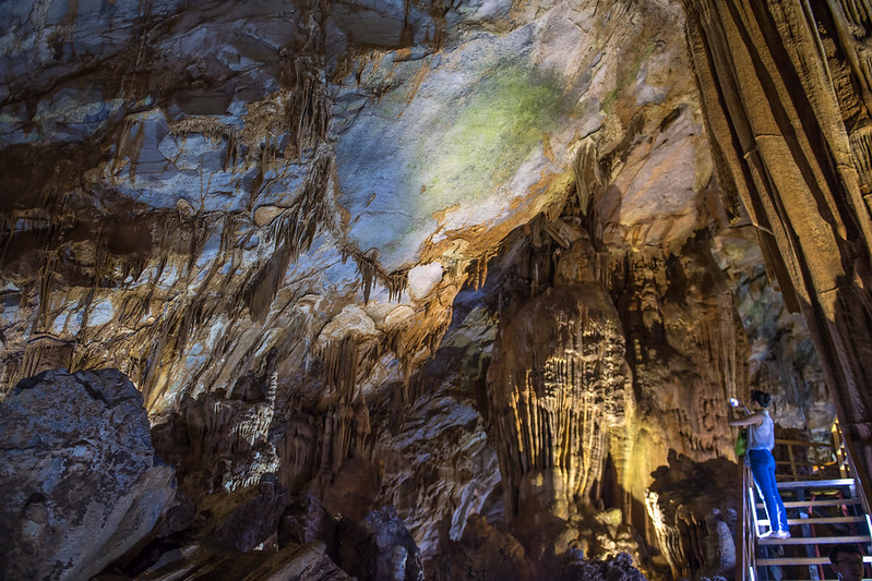 A tourist inside the Tien Son cave, Son Trach commune, Bo Trach District, Quang Binh province in Viet Nam.