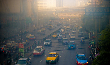 Smog is seen over a busy highway in Bangkok.
