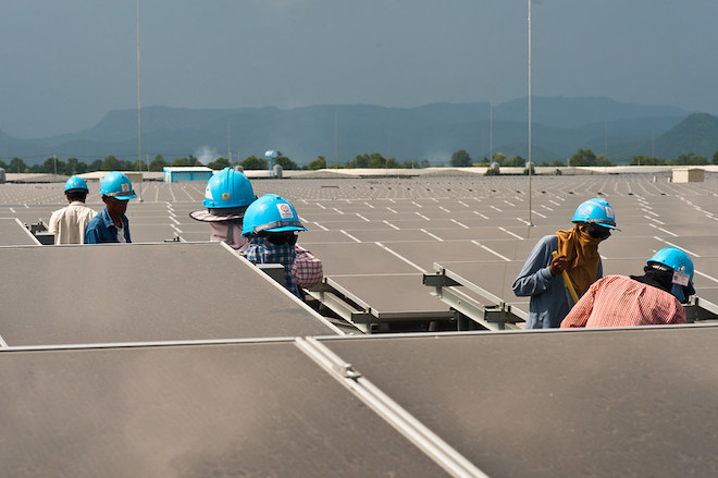 Men working at a solar farm.