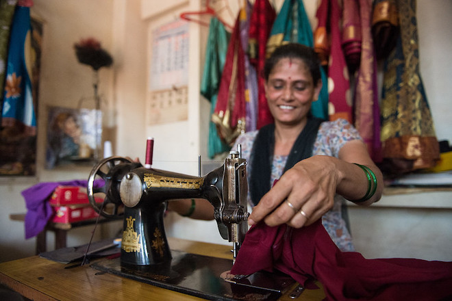A woman at her tailoring shop in the Attavar locality of Mangalore, India. 