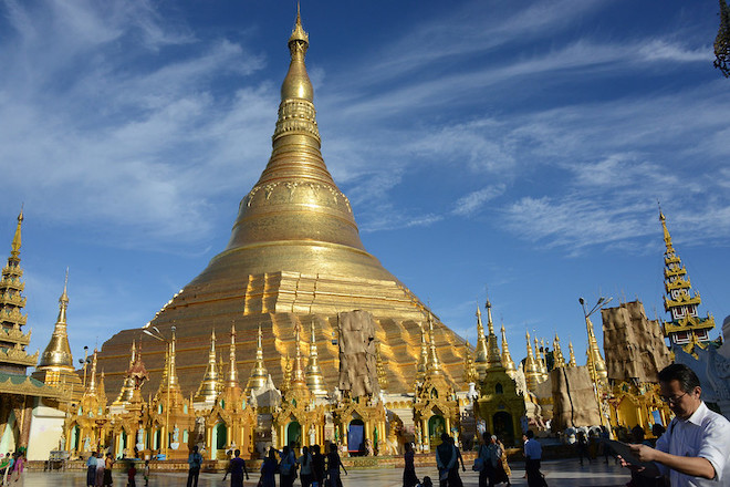 People exploring the Shwedagon Pagoda in Yangon.