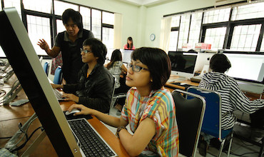 Students attending a computer class. 