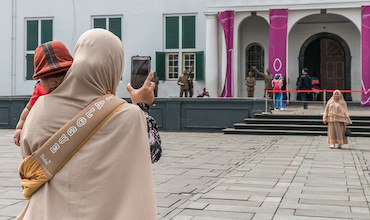 People enjoy themselves at the Fatahillah Square, in the Old Town, Jakarta.