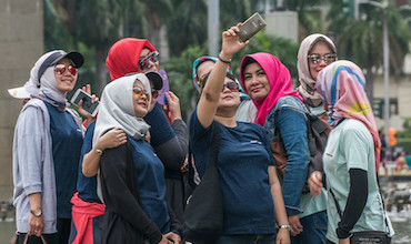 Women taking a selfie in Jakarta.