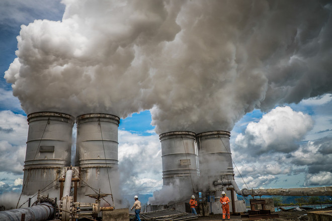 Steam evaporates from drilled holes at a geothermal plant in Indonesia.