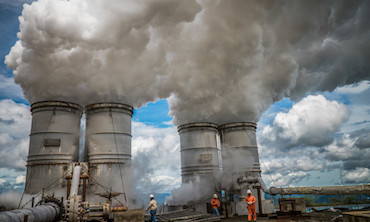 Steam rises from drilled holes at a geothermal plant in Indonesia. 