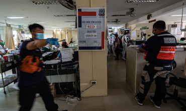 People milling around in a hospital during a red code alert.