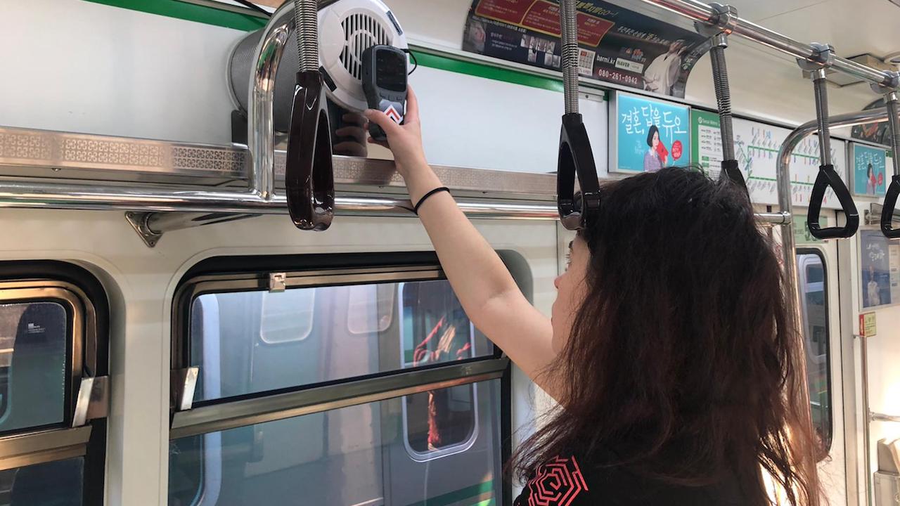 Natalia Mykhaylova, WeavAir founder and CEO, checking a device installed in a railway train in Seoul as part of a project to improve air quality in the city's metros. Photo credit: Courtesy of WeavAir.