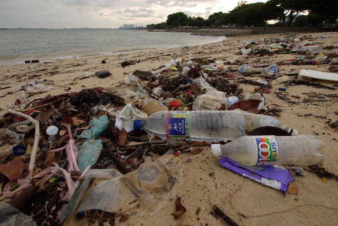 Plastic and other wastes littering a beach in Southeast Asia.