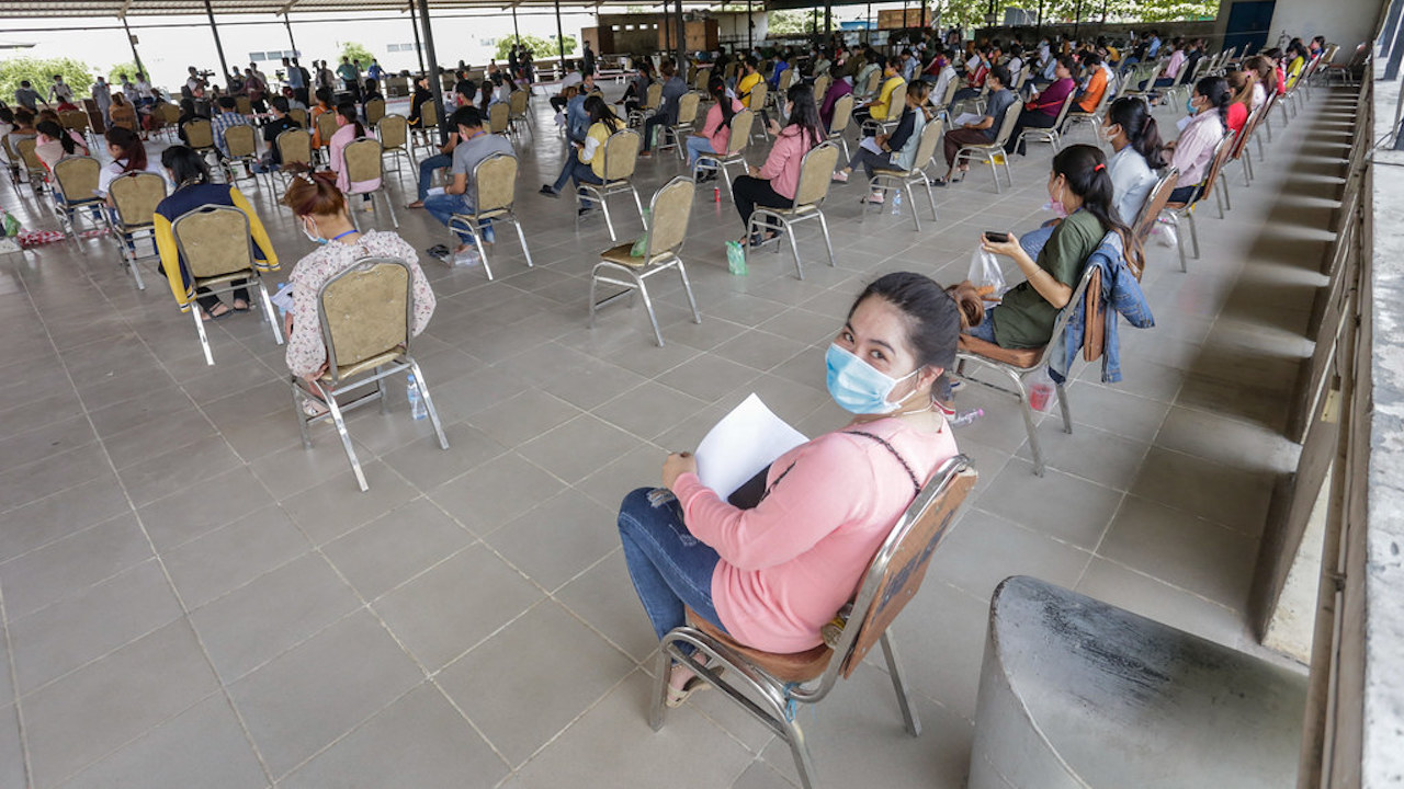 Garment workers waiting to be checked after returning from home after the Khmer New Year, 20 April 2020, Phnom Penh, Cambodia. Photo credit: ADB.