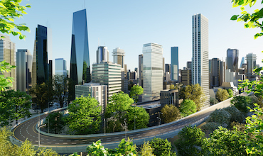 A rendering of a green city with a highway and buildings.