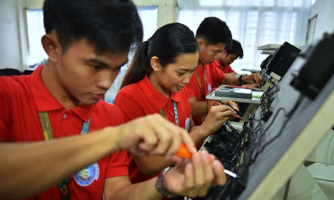 Students get hands-on experience in a school in the Philippines.
