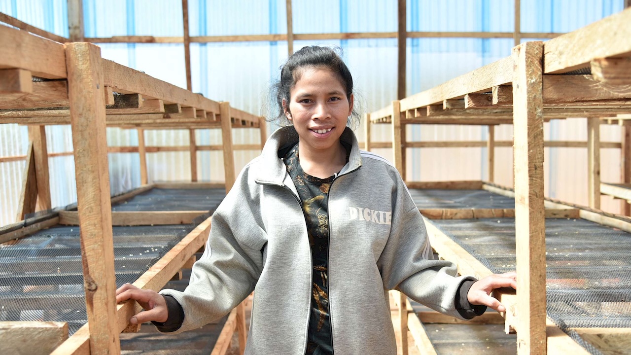 The project taught Gethsamone, 27, advanced coffee planting and processing techniques, reinvigorating her passion for coffee production. Photo credit: Courtesy of Care International in Lao PDR/Koungming (Tom) Changleuxai. 