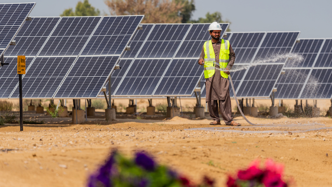 A man working at a solar farm.