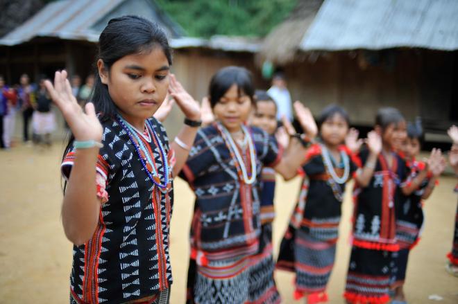Girls from the Co Tu ethnic minority dancing in Zuoih (Zuôih) commune, Nam Giang district, Quang Nam Province. 