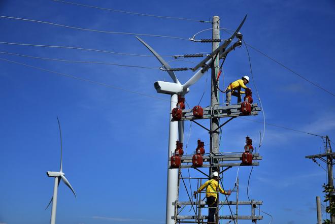 Workers at a wind farm in the Philippines