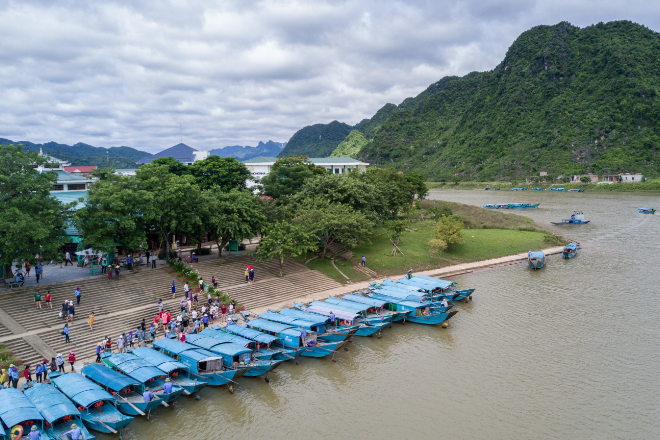 Tourist boats line the banks of the Mekong River.