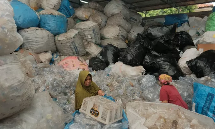 Workers at a plastics recycling plant in Indonesia. Photo credit: ADB.