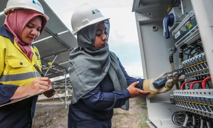 Vena Energy staff Nurul Hidayah and Fatma Mulyana perform operations and maintenance work at Selong in Lombok island, Indonesia.