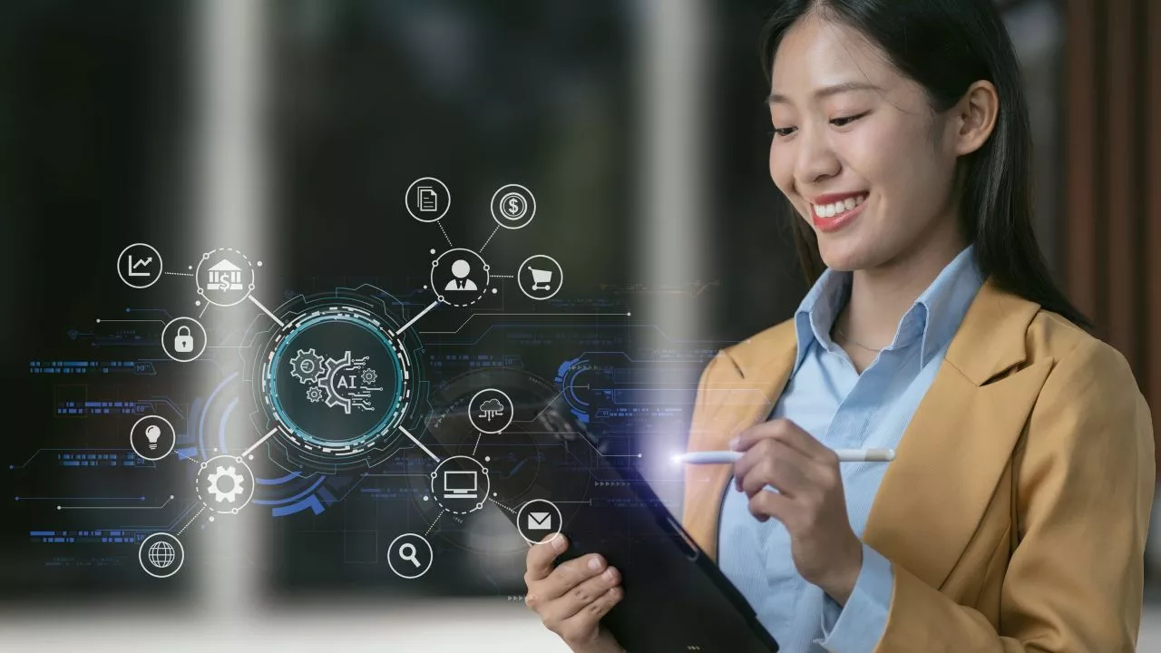 A woman uses a tablet to access AI apps. Photo credit: iStock.