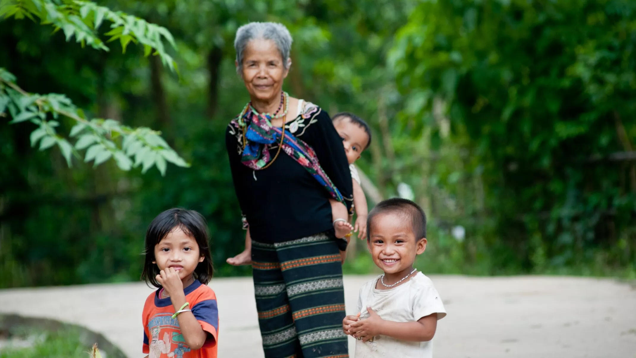 An older woman with children in Viet Nam. Photo credit: ADB.