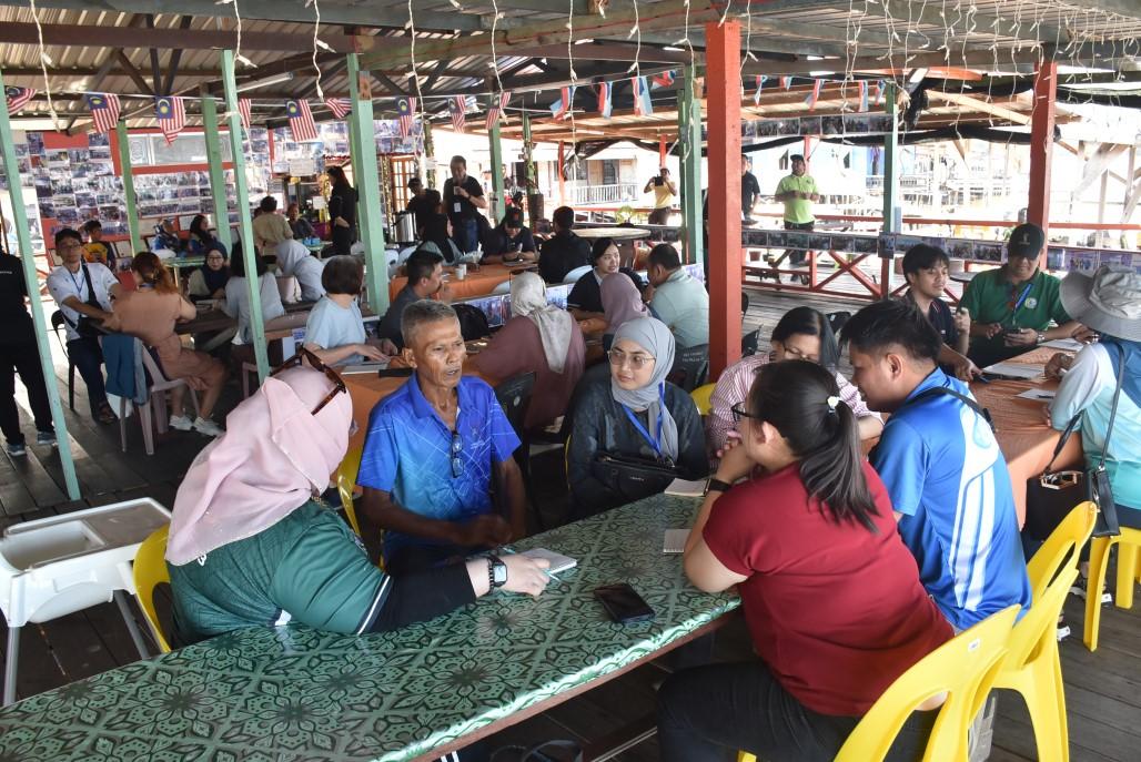 Workshop participants interview oyster farmers on community-based sustainable approaches for inclusive livelihoods during the technical field visit to the Sinar Lentuong Oyster Farm in Mengkabong Bay, Sabah, Malaysia. 